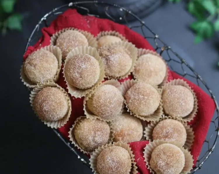 Step 3.1: Dip each mini-muffin upside down into the melted butter, coating the top evenly