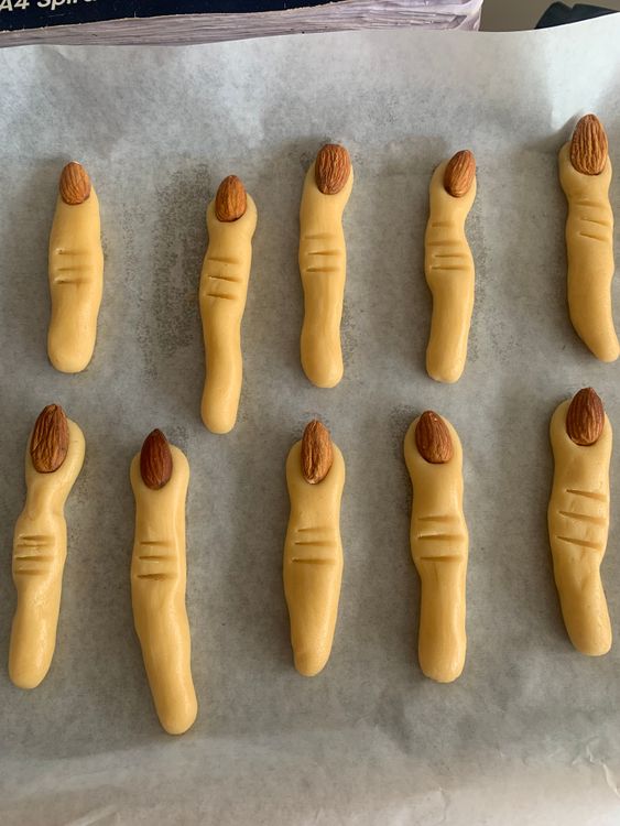 Step 2.1: Press a whole almond onto the tip of each finger to resemble a nail
