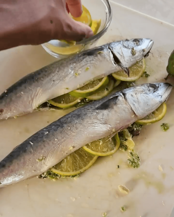 Step 3.2: Stuff mackerel with the butter pesto and add orange slices