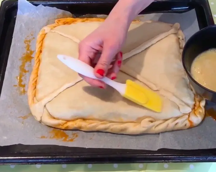 Step 3.1: Whisk the remaining egg and brush it over the pie