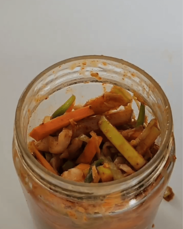 Step 3.1: Transfer the mixture into a clean jar, pressing down firmly as you add it to release any air pockets and ensure it is tightly packed