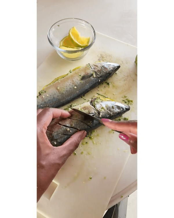 Step 3.3: Stuff mackerel with the butter pesto and add orange slices