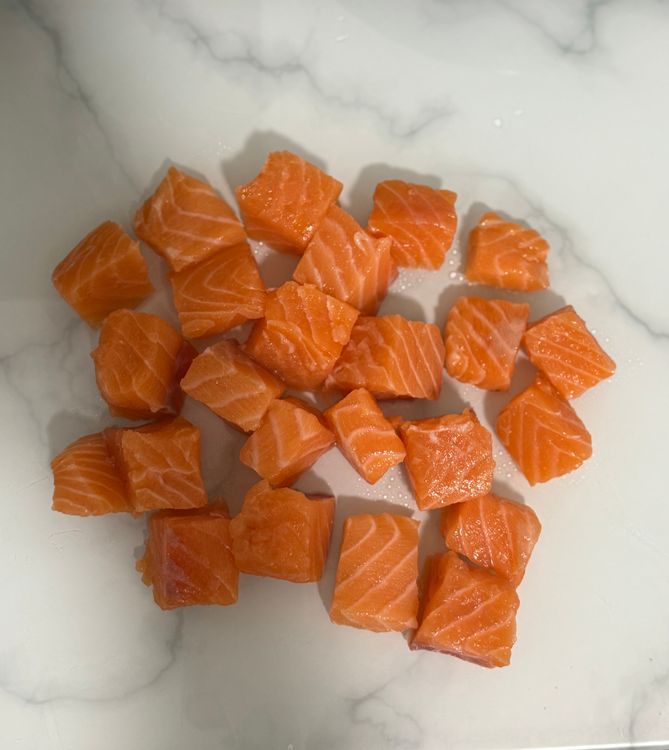 Step 1.1: Cut the salmon into bite-sized pieces and place them in a bowl