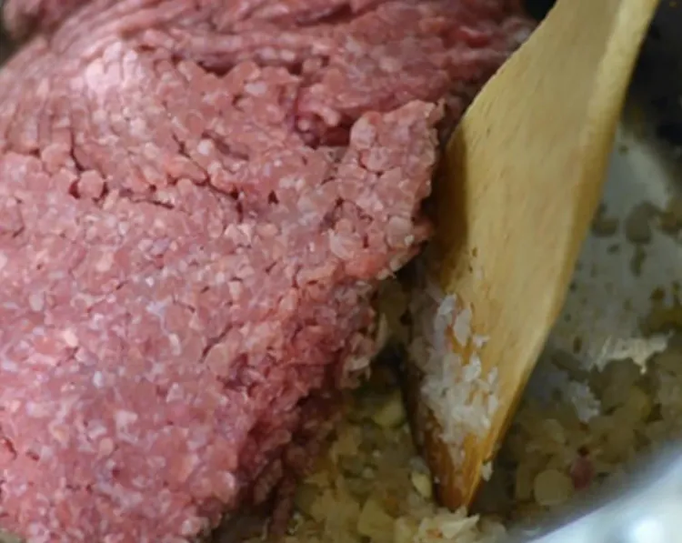 Step 2.1: Add oil, ground beef, salt, ground black pepper, ground cinnamon, and fresh oregano