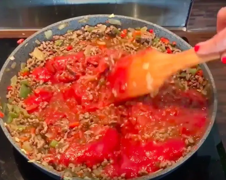 Step 1.1: Add tomato sauce and cook for a few more minutes