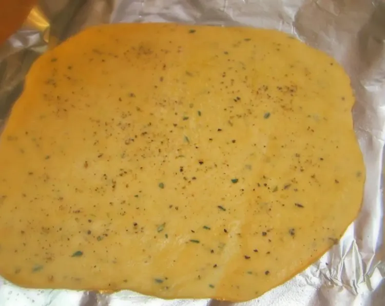 Step 3.1: Once the dough is rolled out, lightly brush the top with additional oil and sprinkle with sea salt or table salt