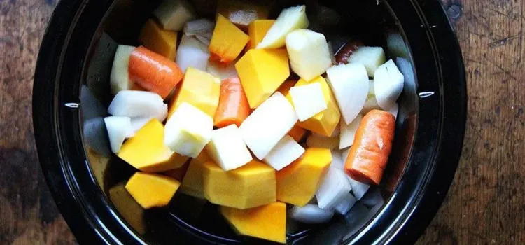 Step 1.1: Place the butternut squash, onion, apple, carrot, and water in a slow cooker