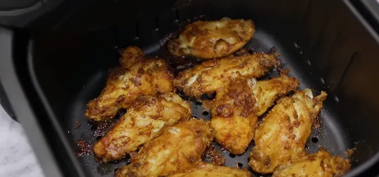 Step 2.1: After 15 minutes, flip the chicken wings and cook for 10 more minutes