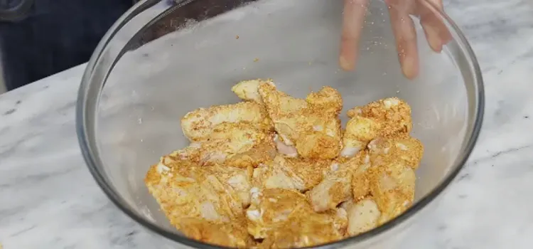 Step 1.1: In a large bowl, toss the chicken drumettes and wings with baking powder, paprika, garlic powder, onion powder, ground black pepper, and salt