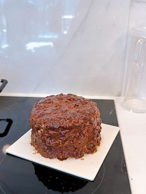 Step 1.1: Remove the cake from the pan by lifting it with the parchment paper