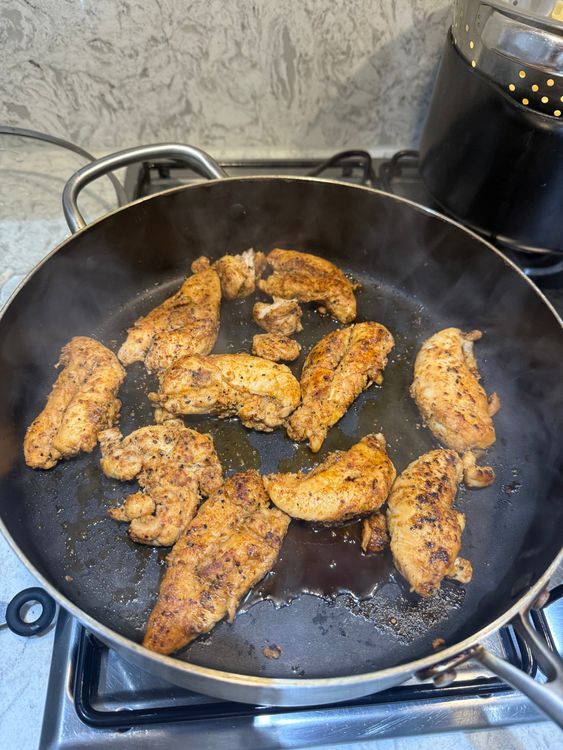 Step 2.1: Lower the heat and cover the pan with a lid to create steam