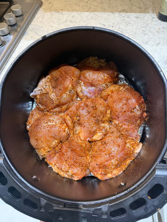 Step 1.1: Place the seasoned chicken into the air fryer at 184°C for 22 minutes, turning halfway through