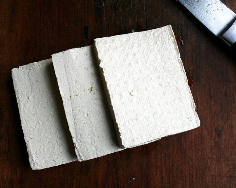 Step 3.1: Cut the drained tofu into three slices