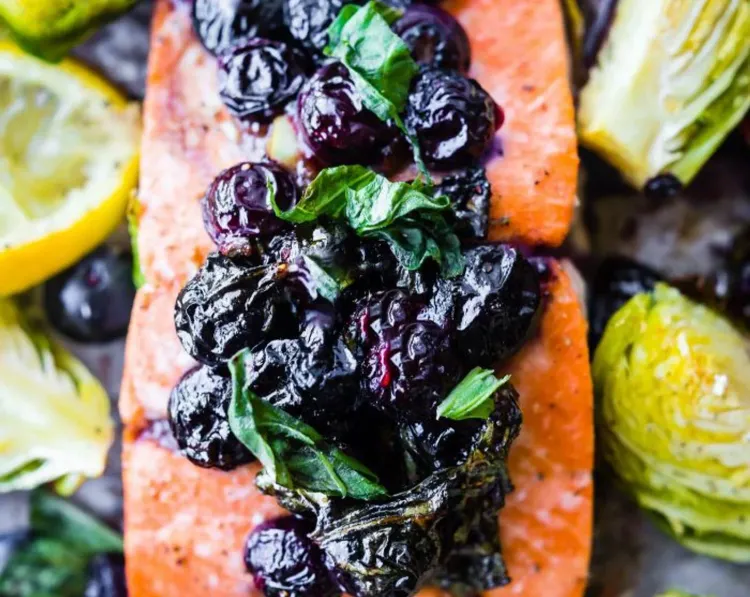 Step 3.1: Spoon the balsamic basil blueberry mixture over the salmon fillets
