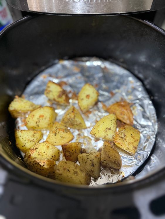 Step 1.1: Place the potatoes in the air fryer at 200°C and cook for 20 minutes, shaking them halfway through