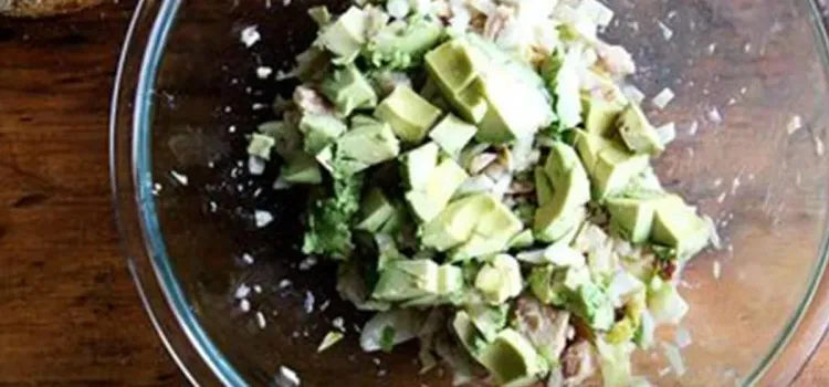 Step 2.1: Dice the avocado and add to the bowl followed by the fresh parsley