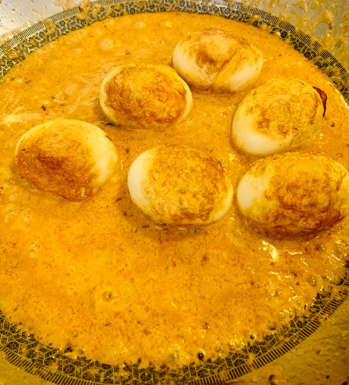 Step 1.1: Add the boiled eggs and stir for a minute