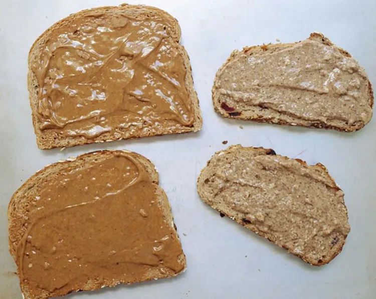 Step 2.1: Add a layer of nut butter to both slices of bread