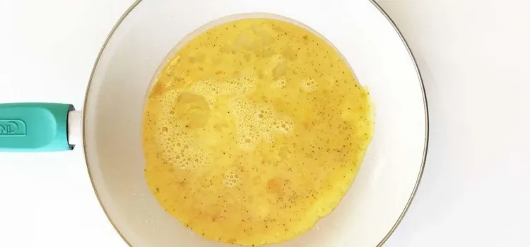 Step 1.1: When the skillet is hot, pour the egg mixture into the skillet and cover