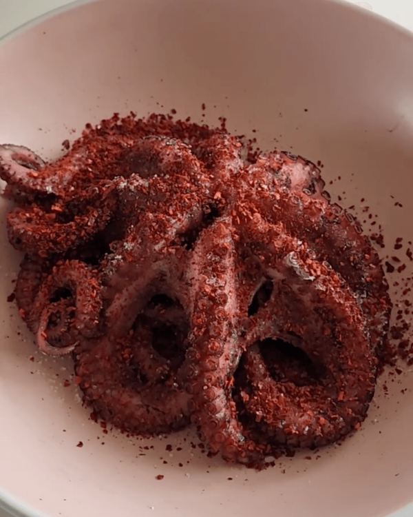 Step 2.1: Marinate the octopus with lemon juice, salt, pepper, gochugaru chillies, and olive oil