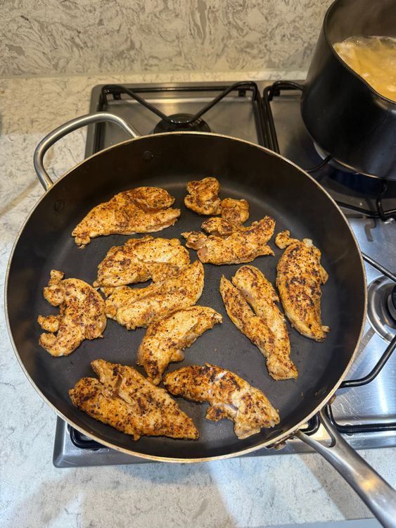 Step 2.1: Heat a pan to medium heat and place the chicken in when hot