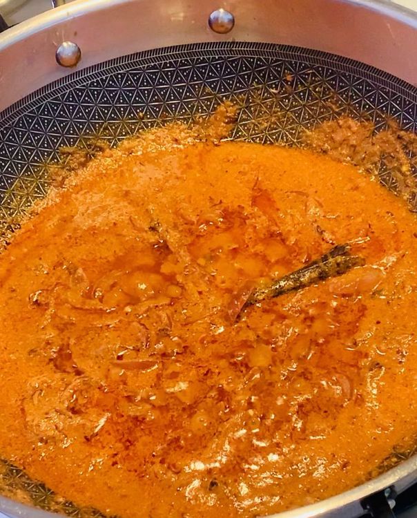 Step 1.2: Add tomato puree and cook for 2-3 minutes until it slightly thickens and the oil oozes out