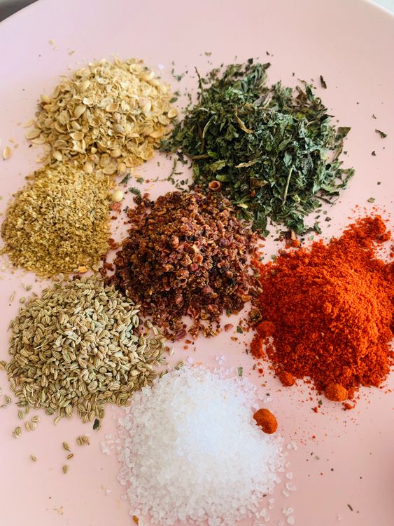 Step 2.1: Add chopped ginger, green chillies, red chilli powder, carom seeds (ajwain), dry pomegranate seeds (anardana), salt, coriander powder, garam masala and mint leaves