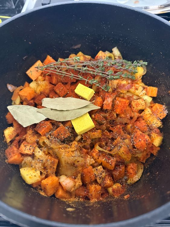Step 2.1: Season with paprika, Cajun seasoning, chicken seasoning, garlic powder, black pepper, salt, thyme, bay leaves, and chicken stock cubes