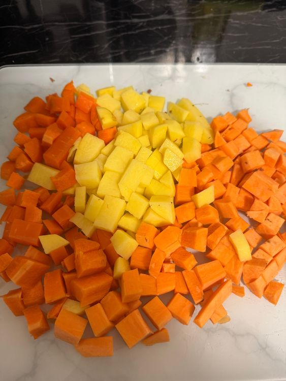 Step 2.1: Add chopped vegetables including carrots, sweet potato, potato, and sweetcorn