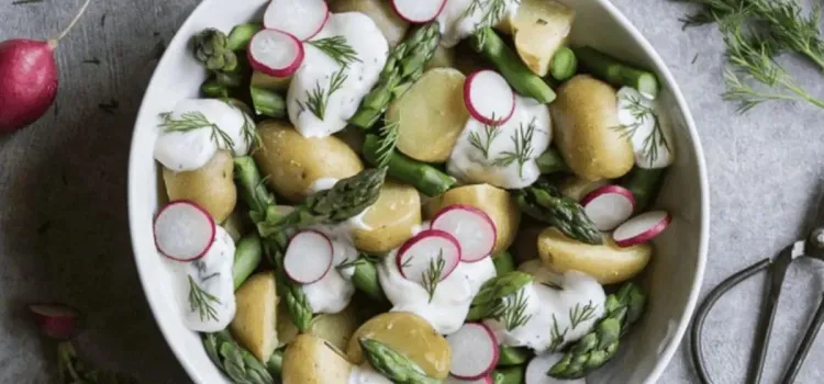 Step 5.1: Once the potatoes have cooled, add the potatoes, asparagus, and radishes to a large bowl in layers, adding dollops of the dressing as you layer the vegetables
