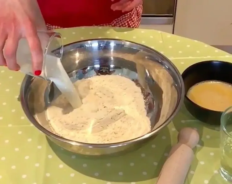 Step 2.1: In a bowl, mix together milk, sunflower oil, two eggs, pastry flour, and salt