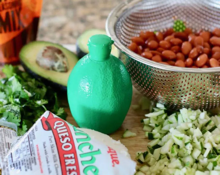 Step 1.1: Toss the pinto beans, taco seasoning, lime juice, diced zucchini, and diced mushrooms in a bowl and mix well