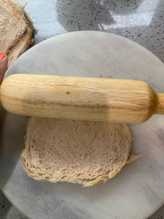 Step 3.1: Trim the crusts off the bread slices