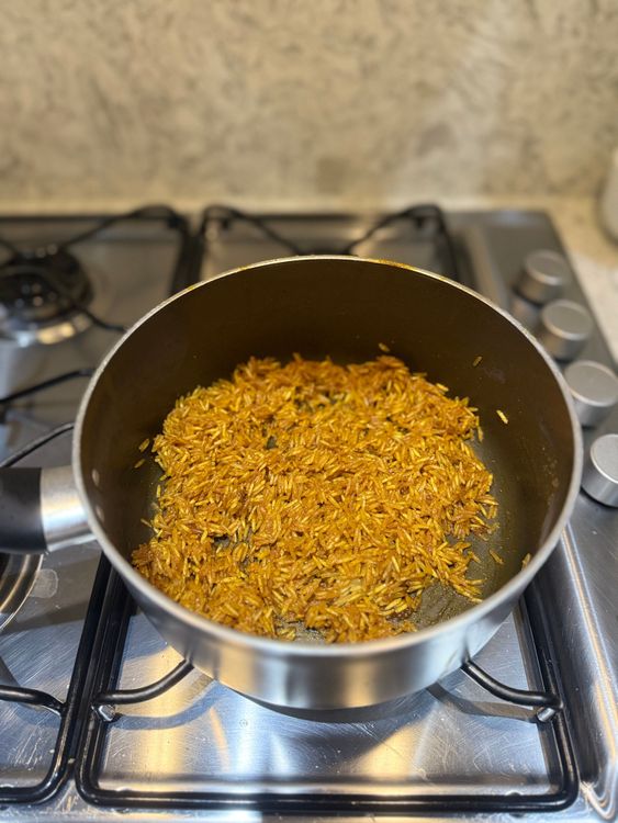 Step 3.1: Add the rice and gently mix until all the rice is coated with the spices