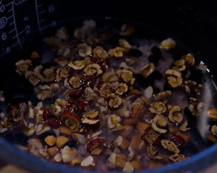 Step 1.1: Add walnuts, almonds, dried red dates, salt, and canola oil to the rice cooker