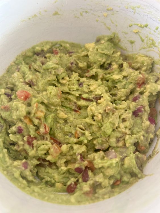 Step 2.1: Add the chopped onions, tomato, and cilantro, combining everything evenly
