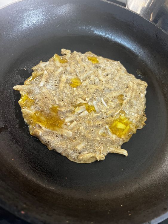 Step 1.1: Pour a little ghee and cook from both sides until golden brown