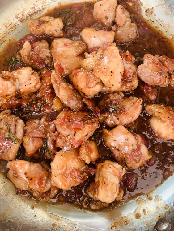 Step 3.1: Lower the heat to medium-low, cover the skillet, and simmer for 8-10 minutes, or until the chicken is fully cooked through and the sauce has thickened slightly
