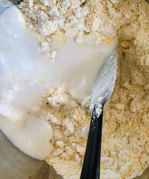 Step 1.1: To the dry mixture, add coconut milk, vinegar, and maple syrup