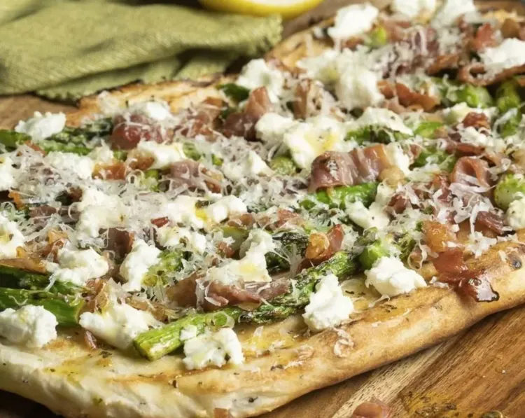 Step 3.1: Immediately scatter on half of the asparagus, prosciutto, and goat cheese
