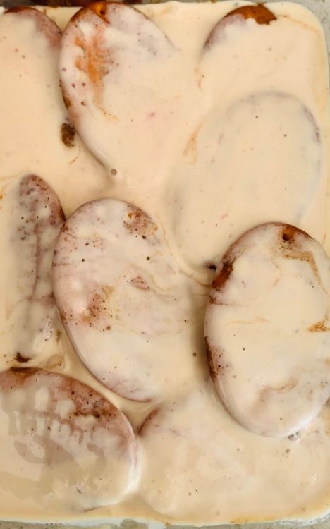 Step 1.1: Spread a layer of ice cream, then add a layer of biscuits dipped in the mixture