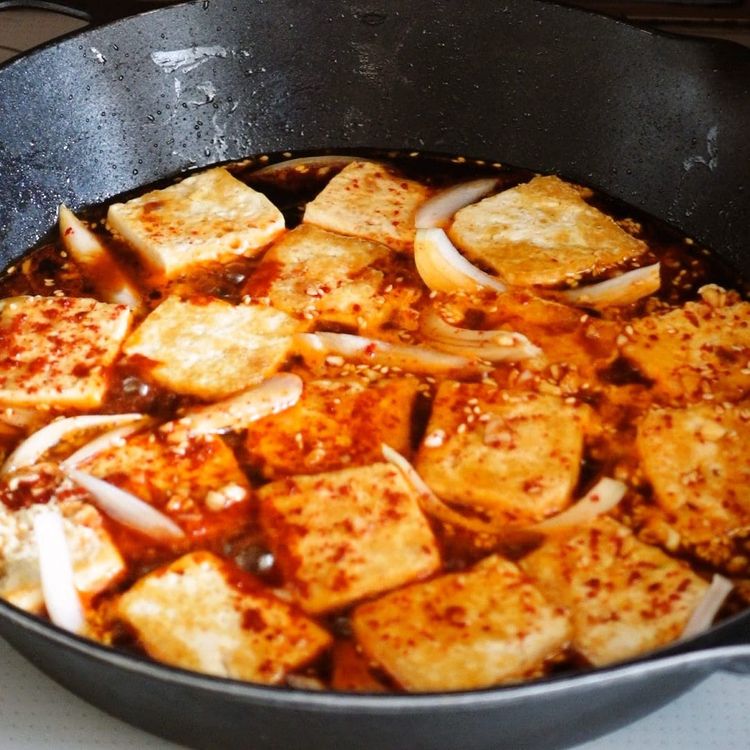 Step 2.1: Pour the mixture into the pan with the fried tofu and mix to evenly coat all the tofu pieces with the sauce