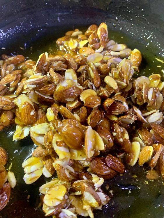 Step 1.1: Turn off the flame, and add almonds to the pan