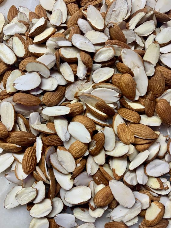Step 1.1: Once cooled, slice the almonds in half and keep aside