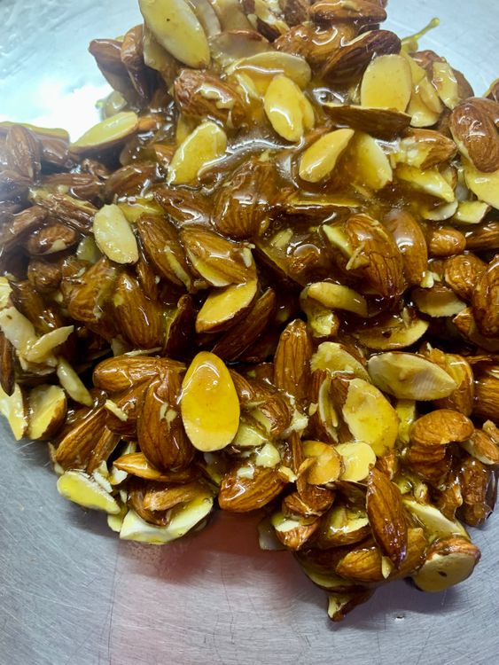 Step 1.1: Immediately transfer the almond mixture to the greased plate or board