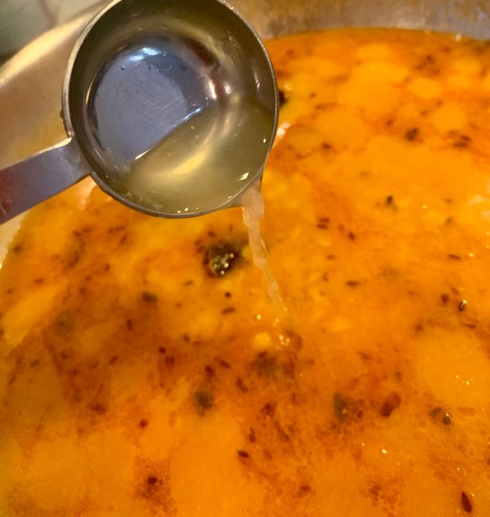 Step 2.1: Add the boiled dal and lemon juice to the pan