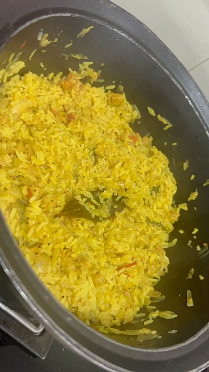 Step 1.1: Once the water starts boiling with rice, reduce the flame to simmer and let it cook