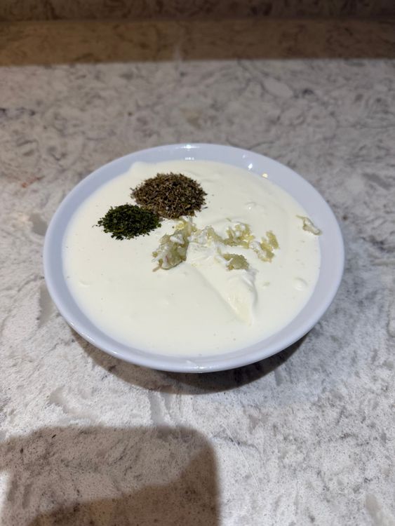 Step 1.1: In a bowl, mix yoghurt, mayonnaise, garlic, dried mixed herbs, dried parsley, lemon juice, and salt to taste