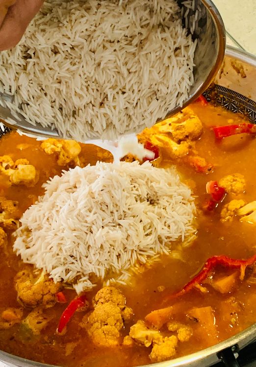 Step 1.1: Drain the soaked basmati rice and add it to the pot