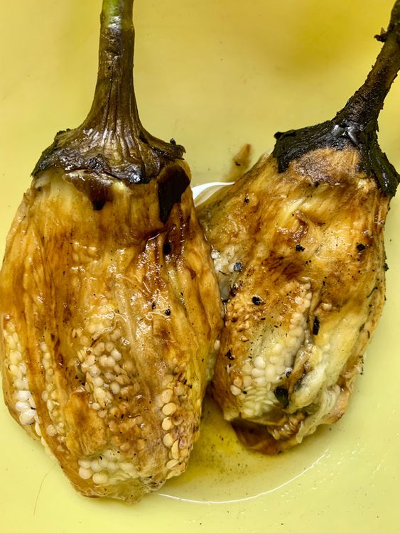 Step 1.1: Once cooled, remove the charred skin of the eggplants by gently pulling the skin with your hands